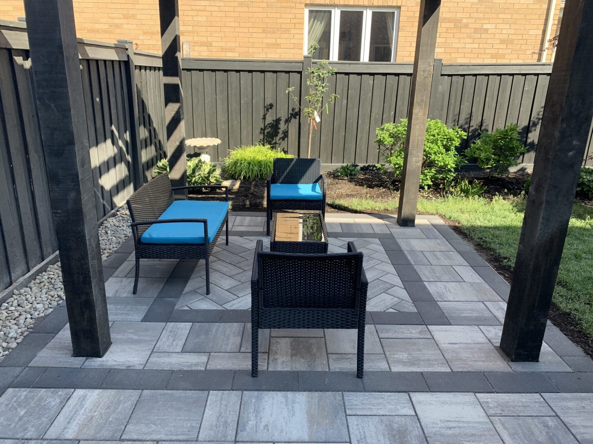Modern Interlocking Stone Design Under Pergola