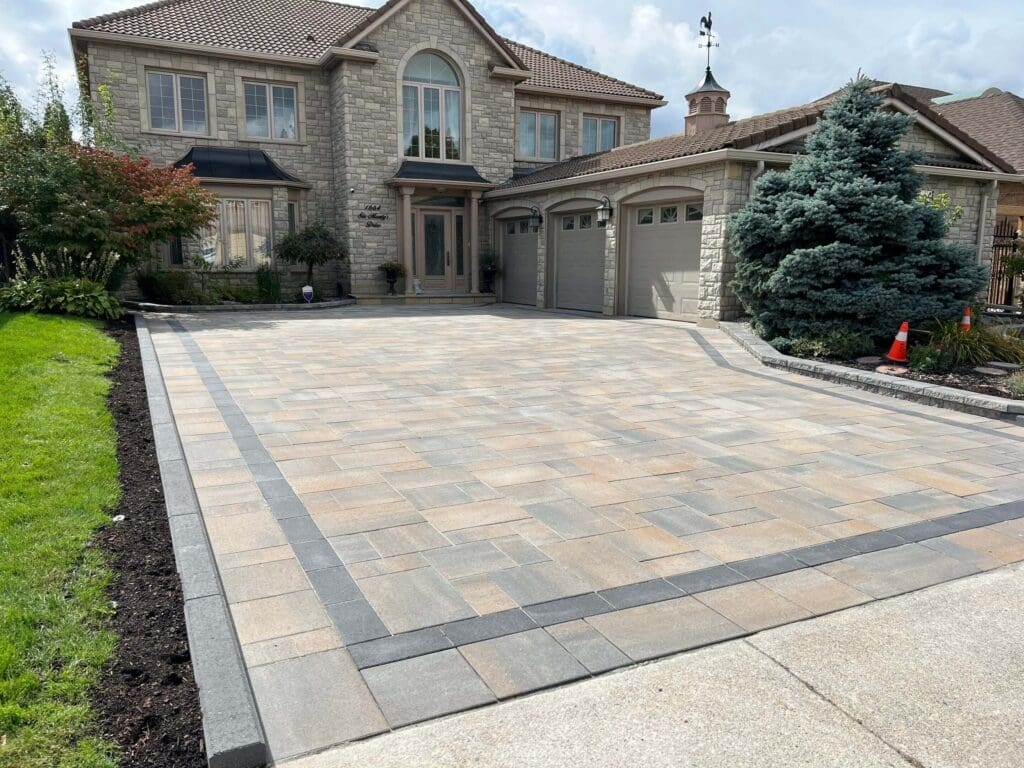 Simple interlocking paver driveway design in Mississauga featuring a multi-colour pattern finish